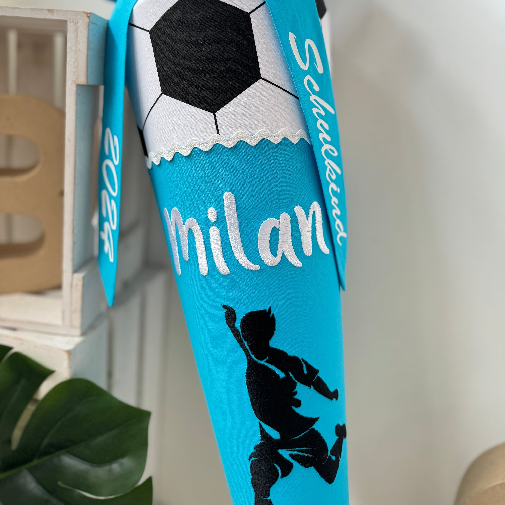 Schultute fussball Spieler turkis